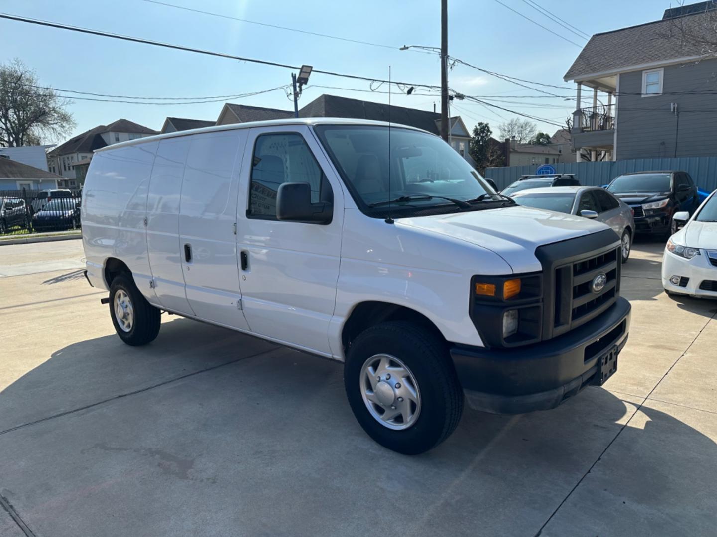 2011 White /Gray Ford E-Series Van (1FTNE2EWXBD) with an 4.6L engine, Automatic transmission, located at 1501 West 15th St., Houston, 77008, (713) 869-2925, 29.797941, -95.411789 - Photo#1